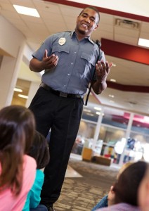 Police officer chatting with students about preventing school shootings